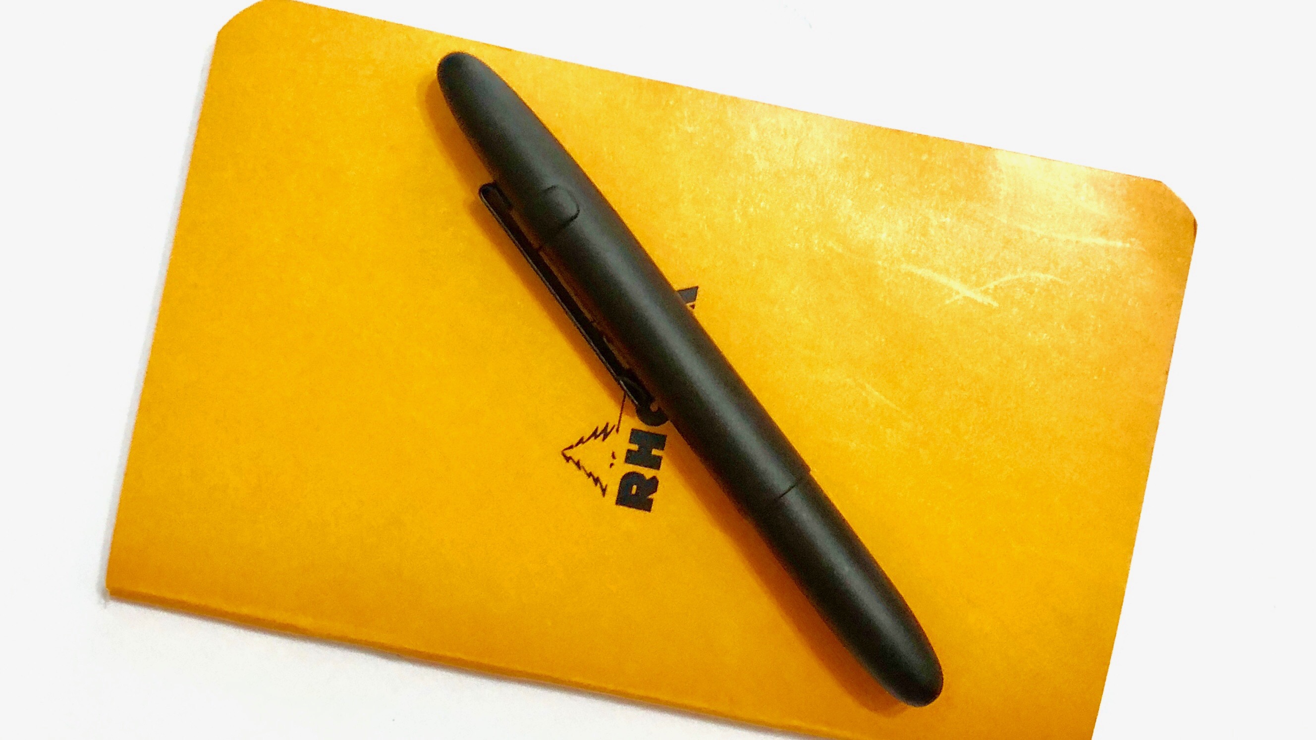 &ldquo;Rhodia A7 notebook with Fisher Bullet space pen&rdquo;